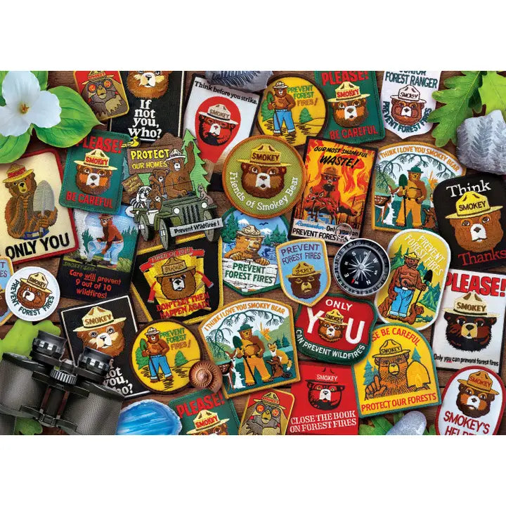 Collection of Smokey Bear-themed stickers and pins on a white background