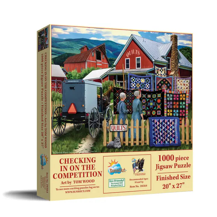 Jigsaw puzzle box featuring a rural scene with a red barn, blue wagon, and people with quilts.