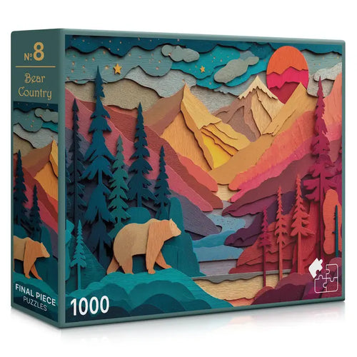 Jigsaw puzzle box with a bear and mountain design on a white background