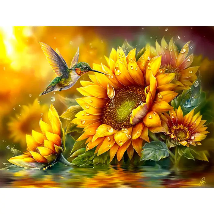 Hummingbird perched on a sunflower with water droplets in a colorful setting